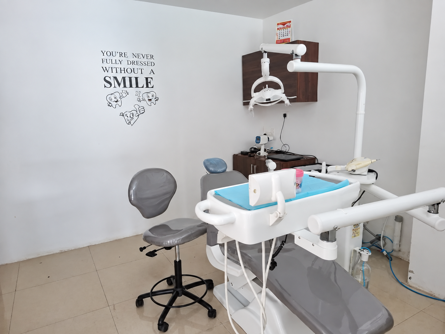 Dental chair, examination light and instrument unit inside White Care Dental